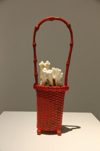 Basket, 2012, found object, concrete filler, bovine and humanteeth, 10 ½ x 5 x 2 inches