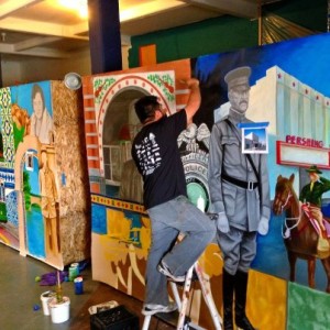 Jesus "Cimi" Alvarado working on his murals.