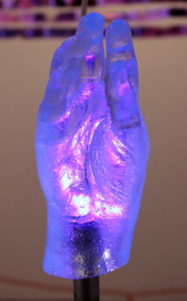 MILAGROS I [detail], 2012, 48x17x17, resin cast of surgically reconstructed hand, metal pipe, silicone, caulk, wood, paint, black light
