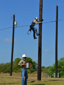Austin Energy linemen relating to each other
