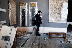 A Unesco member records the damage at Cairo's Museum of Islamic Art, which was recently bombed. Associated Press