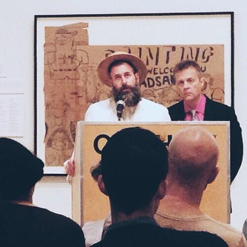Kenneth Goldsmith (left) and Christian Bok, speaking at the CAMH, from Goldsmith’s Twitter account