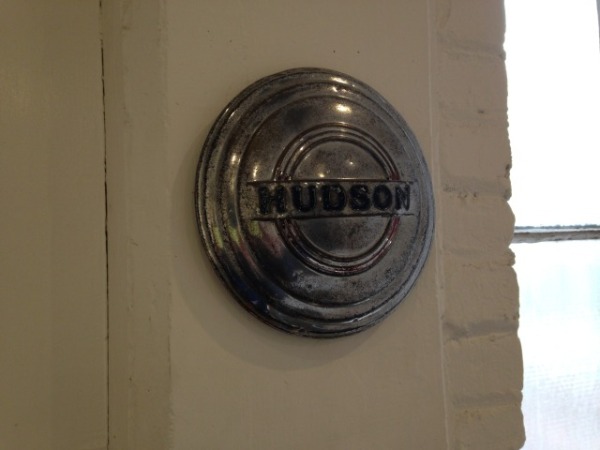 Gallery windows. Hudson hubcap as found object.