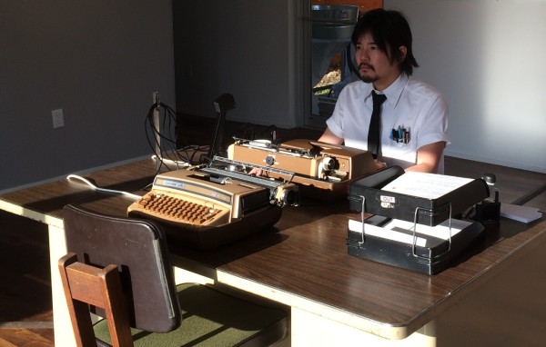 Mat Kubo preparing for a performance of "No Talking, Just Typing"
