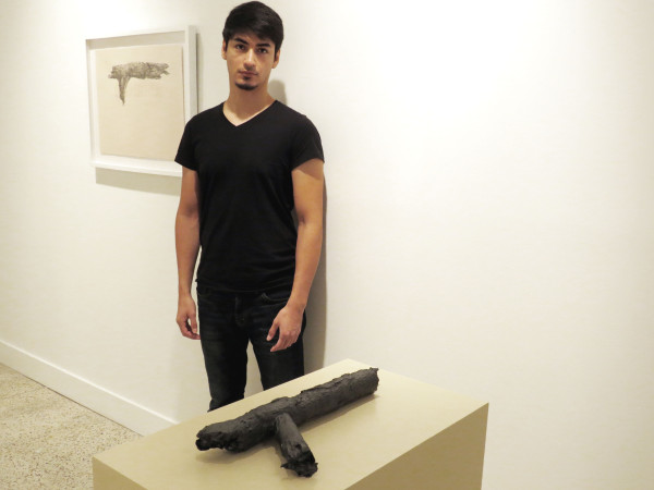 Fernando Andrade with his work at the Guadalupe Cultural Arts Center (image: David Rubin)