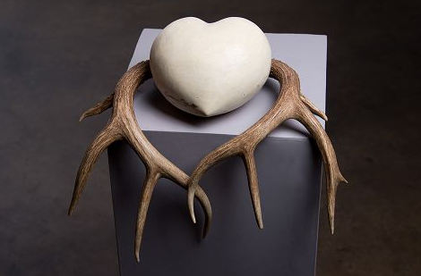 Sabine Senft, #7 Rooted, 2014. Handcarved limestone, antlers, gold leaf.