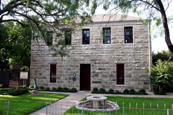 A stone, two-story building.