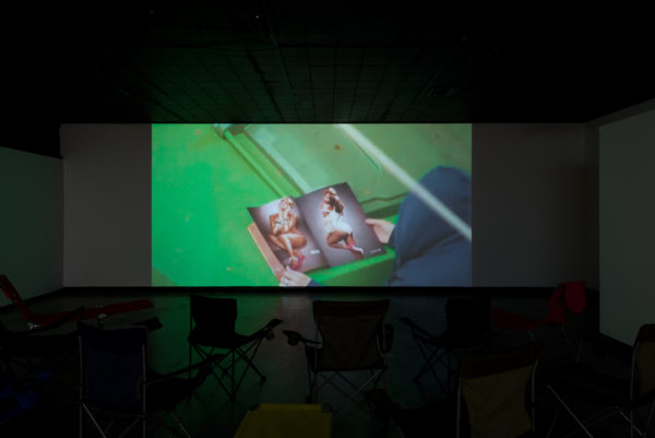 Zoom Test, Liz Rodda, installation view of video with camp chairs, 2016. 
