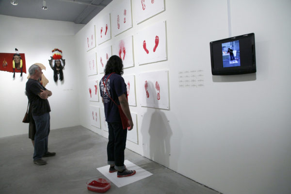 Indian Standing in the Exact Spot Looking at Contemporary Native American Art II, 2012, performance