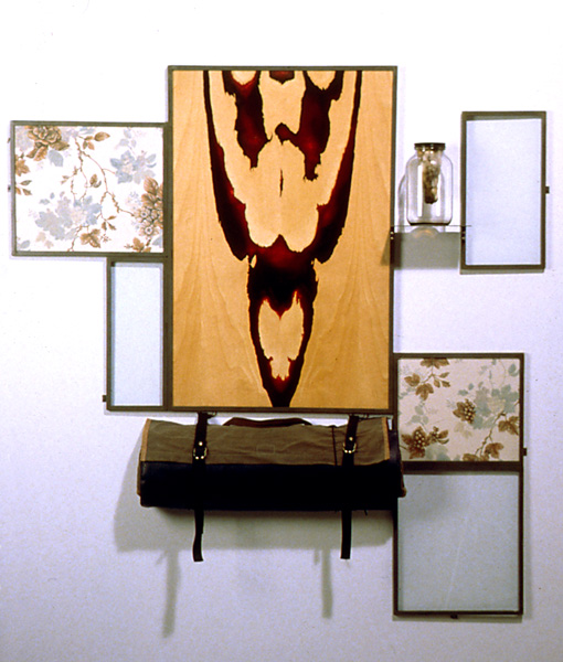 Heterotaxia #2, 1994, oil on printed fabric and birch plywood, plate glass, steel frame, jar with molding bread, shooting mat, 58 x 57 x 4 in.