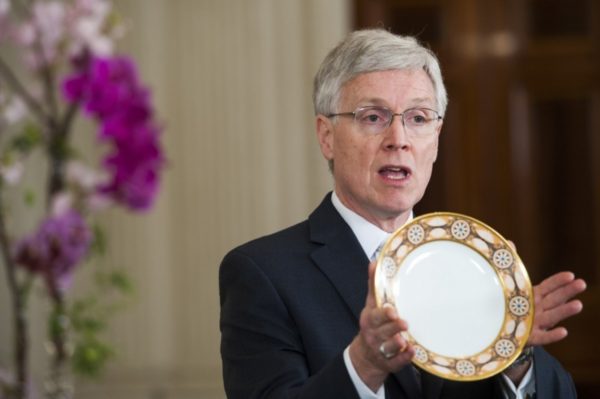 White House Curator William Allman holds a historic plate in the State Dining Room in 2015. (Katherine Frey/The Washington Post)