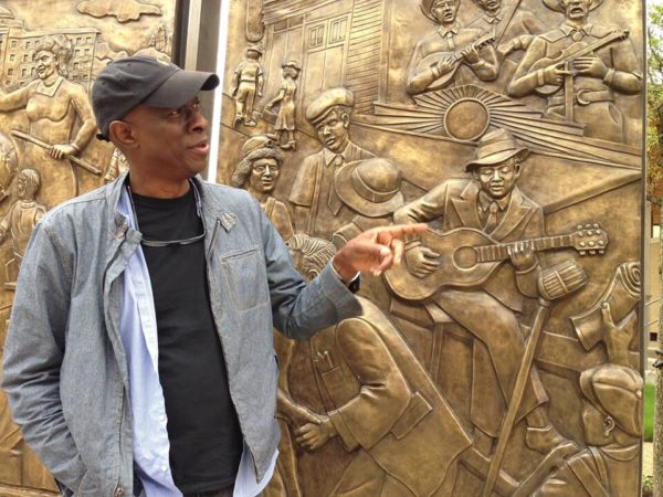 Encore Park Sculpture Wall - blues musician Keb Mo gesturing to Robert Johnson in panel (credit Jeffrey Liles)