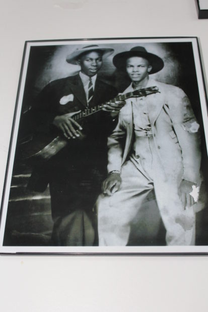 NotRobertJohnson (in the exhibit). This photograph appeared in Vanity Fair in 2008, where it was identified as Robert Johnson and fellow musician Johnny Shines. Lively debate ensued, and the image has been discredited.