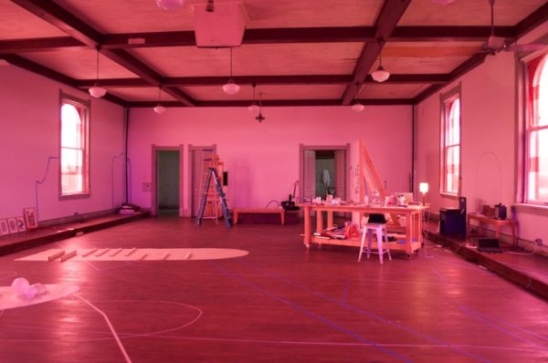 Pink room: During their stay, Alisha Croft and Marguerite Lloyd covered the many windows in their third floor studio with pink cellophane, casting the room in a strange pink glow. Photo Credit: Tatiana Ryckman.