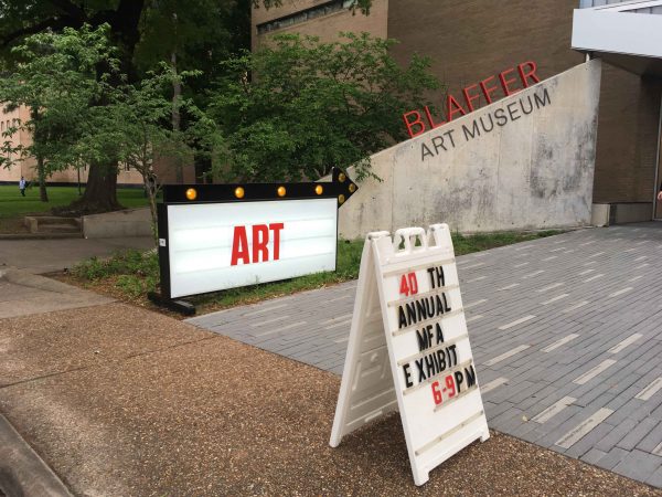 The entrance to the UH MFA show featuring a sign by Alton DuLaney