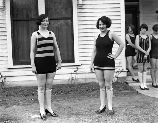 Girls model swimsuits to be worn at the bathing girl revue, a feature of the annual tourist day celebration, 1926. San Antonio Light Photograph Collection.