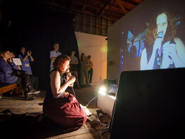 Julia Claire Wallance performing at the 2019 Satellite Art Show in Austin Texas