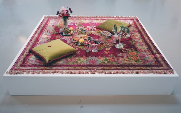 Erin Stafford, A Lover’s Picnic followed by Post-Coital Tristesse, 2019. Rug, found objects, food, wine, candles. 82 x 82 x 37 inches