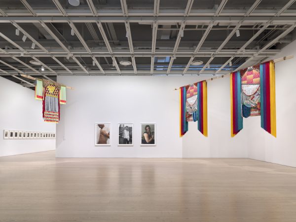 Installation view of the Whitney Biennial 2019. At left, Alexandra Bell's Friday series.