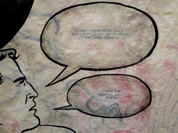 Enrique Chagoya, Crossing 1, detail of Superman’s head and speech bubbles.
