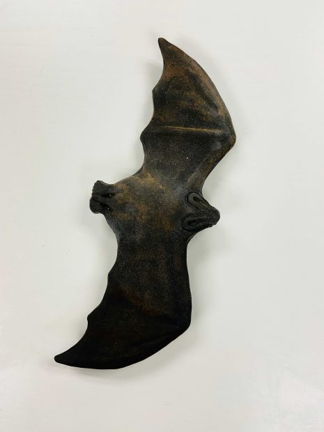 Ceramic bat sculpture by artist Celia Eberle