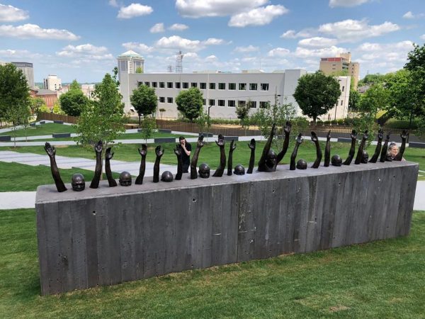 Raise Up, 2016. Bronze, approx. 25 feet long. View of work installed at the National Memorial for Peace and Justice, 2018. Photo: © Hank Willis Thomas