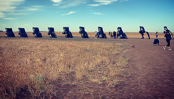 A-photograph-by-Ali-Reed-of-Amarillo's-Cadillac-Ranch-Trash-cans-painted-with-the-words-Black-Lives-Matter