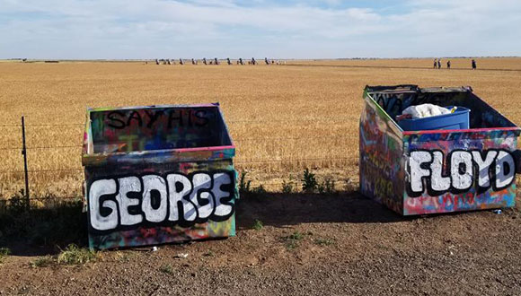 A-photograph-on-Reddit-of-Amarillo's-Cadillac-Ranch-Trash-cans-painted-with-the-words-George-Floyd