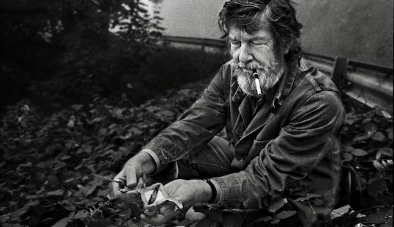 John Cage picking mushrooms in the woods, William Gedney Photographs and Papers, David M. Rubenstein Rare Book & Manuscript Library, Duke Universi