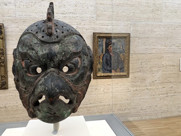 Gigaku Mask of the Karura Type, 8th century Japanese. Back; Man in a Blue Smock, c. 1896–97 Paul Cézanne.