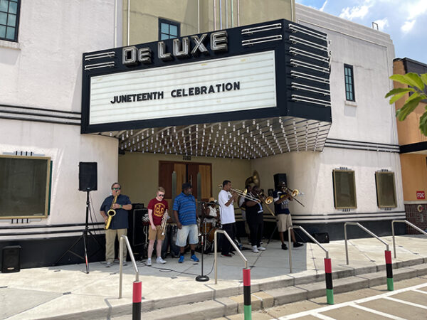 A band plays outside the DeLuxe Theater, 5th Ward, Houston Juneteenth 2021