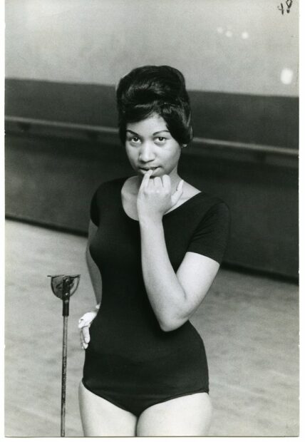 A black and white photograph of a young black woman. 