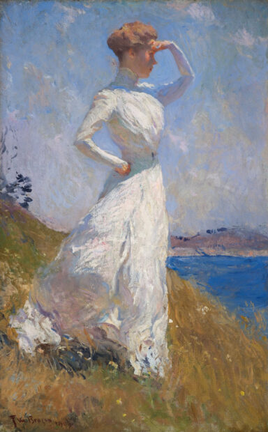 An impressionist style painting of a woman walking alongside a body of water. The woman is wearing a long, white, flowing dress with full sleeves and has one hand positioned at her hip and the other raised covering her face as she looks off into the distance. Painting by Frank W. Benson. 