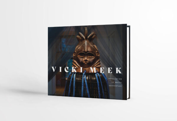 The cover of a catalog of the work of artist Vicki Meek. The cover depicts an art installation by Meek