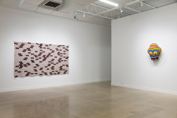 An installation view of an art show by Nomin Bold. Featuring two wall sculptures