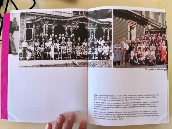 A spread of a catalog featuring black and white photographs of factory workers. 