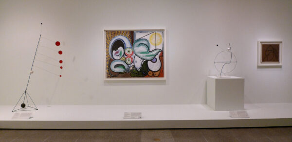 Installation view with paintings and sculptures by both Calder and Picasso