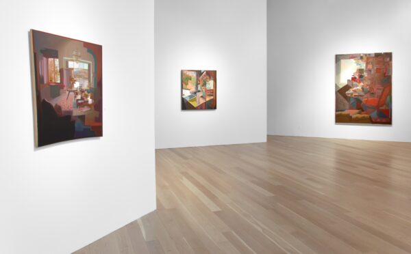 A photograph of the installation of Dan Sutherland: My Father's Desk at Moody Gallery. The image shows three paintings hanging on white gallery walls.