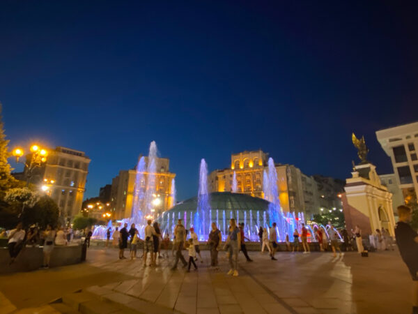 Photo of a bustling Independence Square in Kiev at night