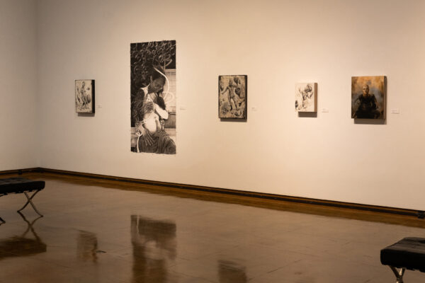 Exhibition image with paintings and works on paper on the walls