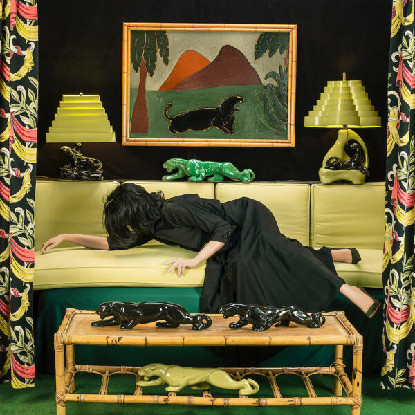 Image of an anonymous woman reclining on a yellow couch.