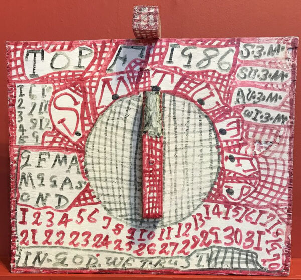 A photograph of a sculptural work by Zebedee Armstrong. The artist has drawn red and black line patterns across a wood panel and includes text which reference days of the week.