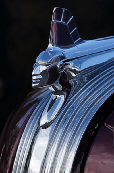 Image of the sleek and stylized hood ornament of a Pontiac car