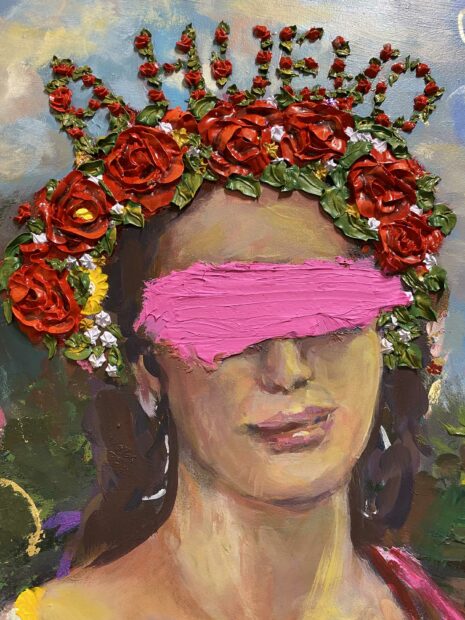 Detail of a portrait of a woman with her eyes crossed out by thick pink paint, a crown of roses, and the words a huevo embedded into the crown