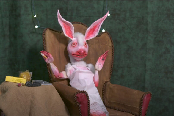 A still image from "Bad Bunny," by Sarah Fox. The image shows an anthropomorphized female bunny sitting in an armchair while smoking a cigarette.