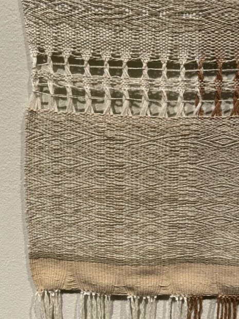 detail of a woven work by Jenelle Esparza with muted and natural tones