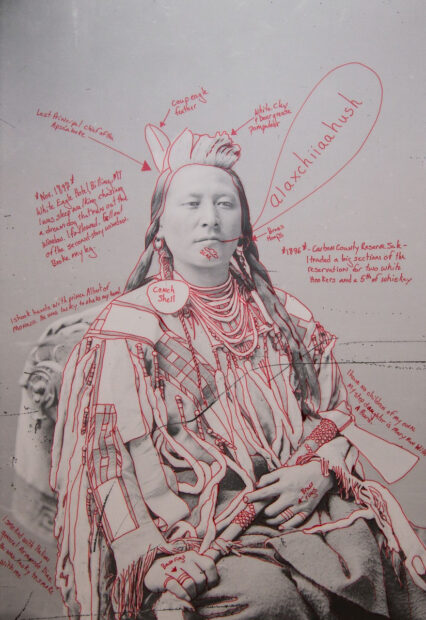 Historical image of a native american person with red notes and doodles surrounding the figure