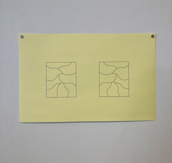 A print on yellow paper of two rectangular shapes with lines intersecting each rectangle.