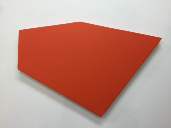 A trapezoidal artwork that is painted orange and hanging on a wall.