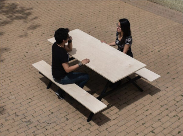 Students sitting at a picnic table
